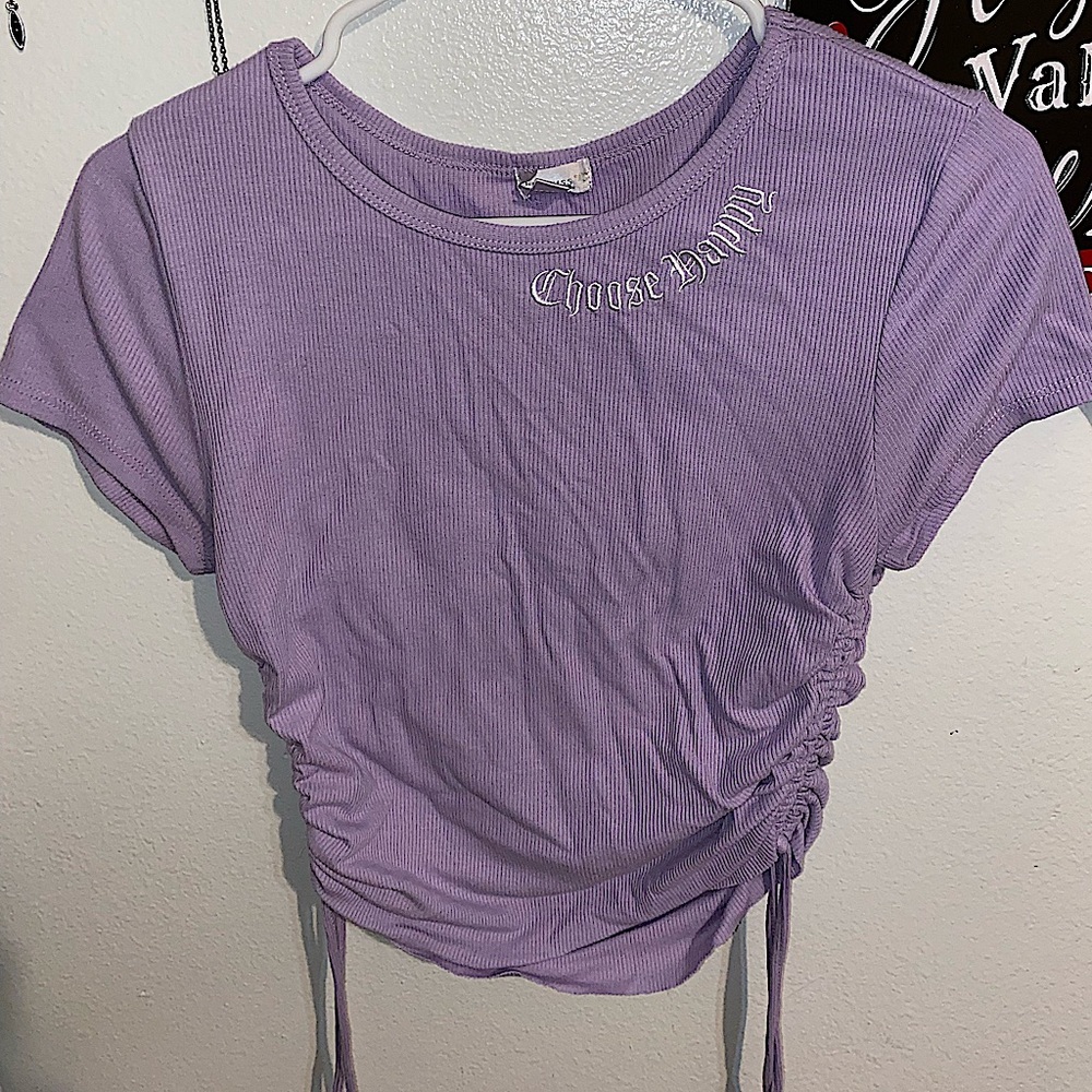 It’s a purple shirt, brand is SHEIN, it’s a size small